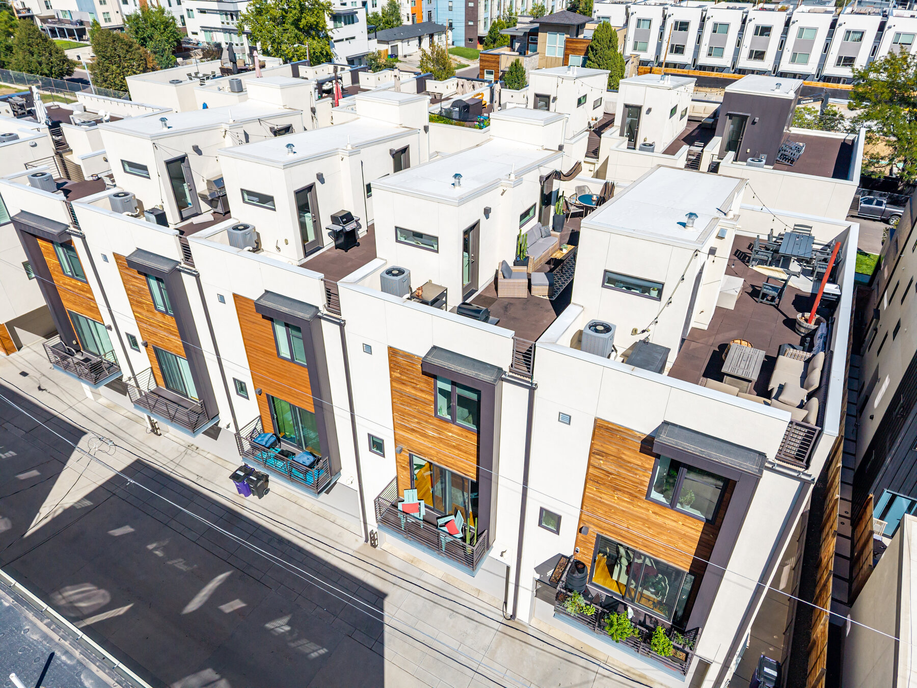 Aerial view of the townhome row and surrounding neighborhood