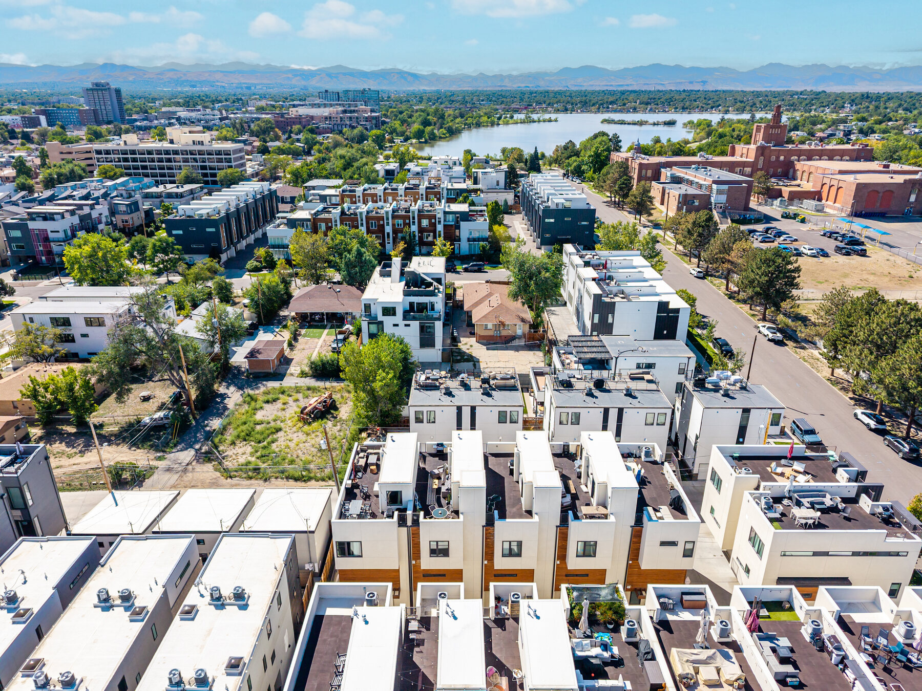 Aerial view showing the home near Sloan's Lake and neighborhood green space